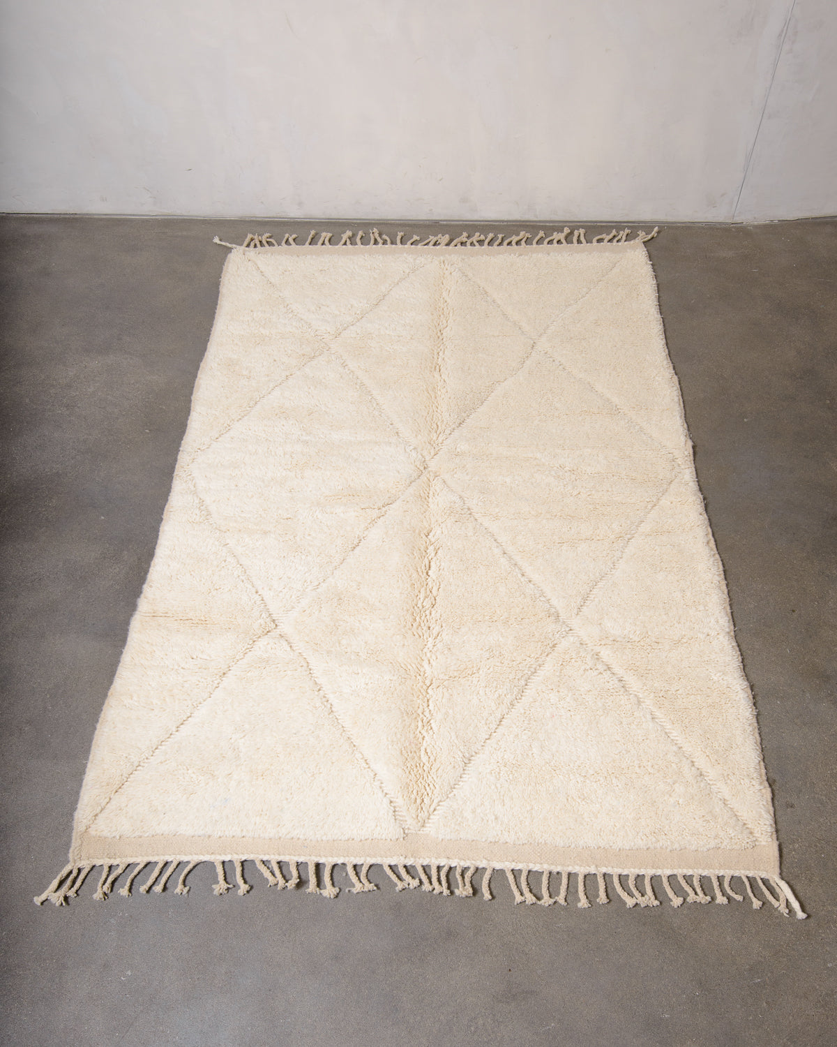 Modern, designer, handcrafted Berber rug from Morocco. Beniourain carpet with minimalist design, natural wool pile and a fluffy texture.